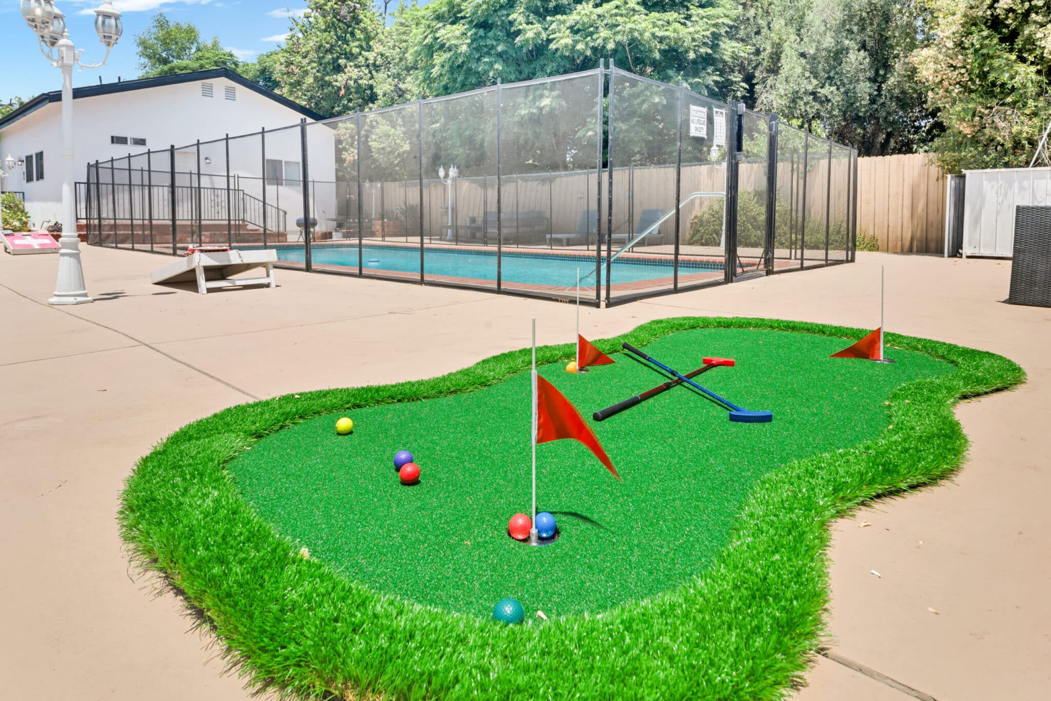 Mini golf putting green beside swimming pool at Northridge Addiction Treatment Center